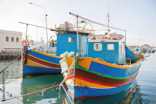 Wallpaper Mural Mediterranean traditional colorful boats luzzu. Fisherman village in the south east of Malta. Early winter morning in Marsaxlokk, Malta. Torontodigital.ca