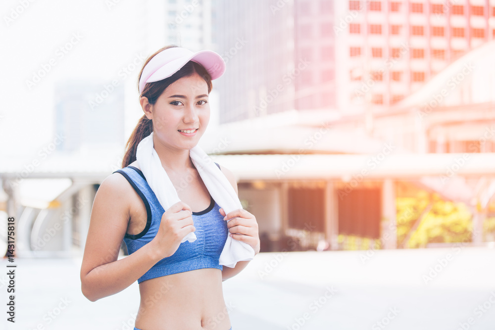 Asian woman smile and rest when finish for exercise, outdoor exercise concept. Asian woman smile and rest when finish for exercise, outdoor exercise concept.