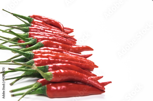 Red hot chilli peppers on white background