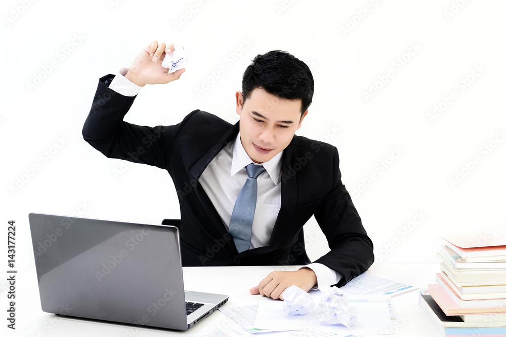 young asia businessman working at office with laptop and having a problems at the office on white background young asia businessman working at office with laptop and having a problems at the office on white background