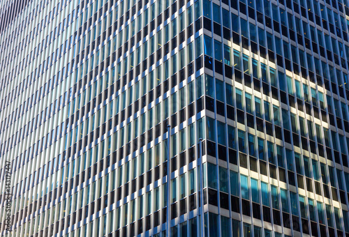 Closeup of glass and concret building.