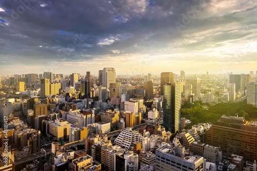 Photography Cityscape of Tokyo, city aerial skyscraper view of office building and downtown and street of  minato in tokyo with sunset / sun rise background with yellow sunlight effect