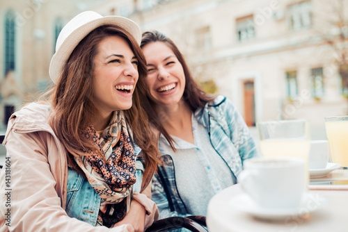 Two beautiful women chatting photo