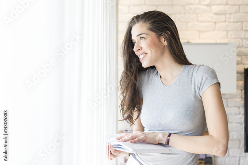 Morning scene. Woman enjoying a book next to window Free Download Morning scene. Woman enjoying a book next to window - GFXLoad