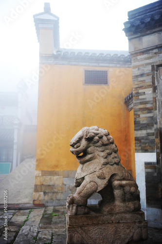 Stone lion in chinese temple