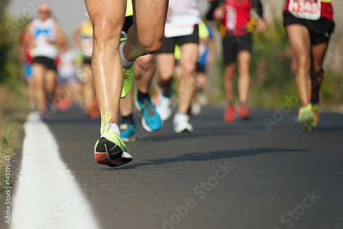 Marathon running race, runners feet on road