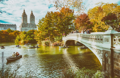 NEW YORK CITY - OCTOBER 2015: Tourists in Central Park enjoy foliage season. The city attracts 50 million people annually © jovannig