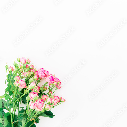 Pink roses on white background. Bouquet with roses. Flat lay, top view. Floral background