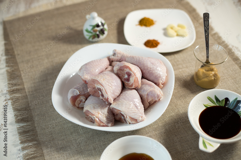 The chicken leg baked in an oven on a glass plate on a gray background The chicken leg baked in an oven on a glass plate on a gray background