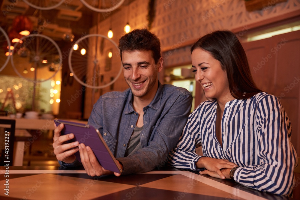 Very happy young couple in restaurant Very happy young couple in restaurant
