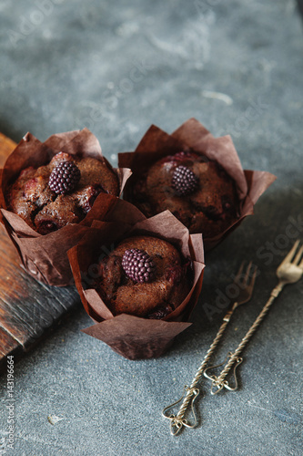 Dark chocolate muffin with cherry and sauce photo