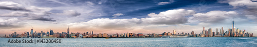 Panoramic view of New York City skyline at dusk