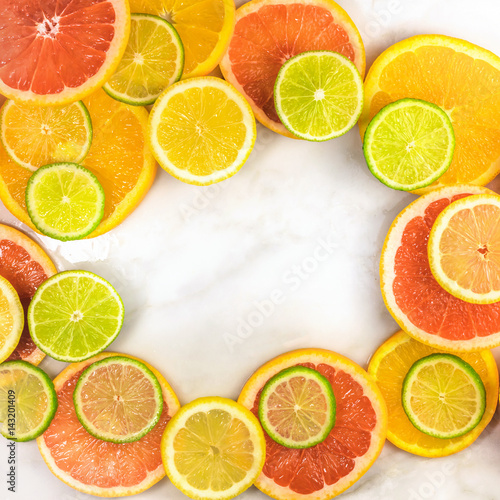 Vibrant frame made up of juicy citrus fruits