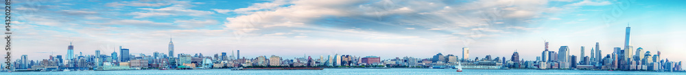 Panoramic sunset view of New York City skyline from Jersey City