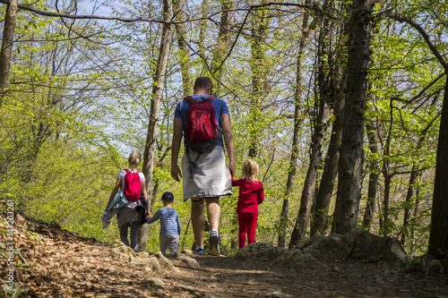 Parents with children walking by hiking trail