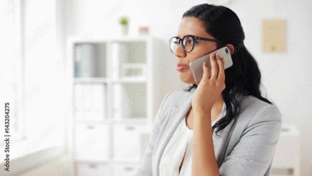 businesswoman calling on smartphone at office