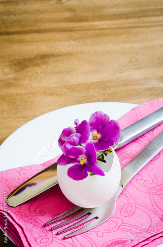 Easter Festive Table Setting With Fresh Flower.