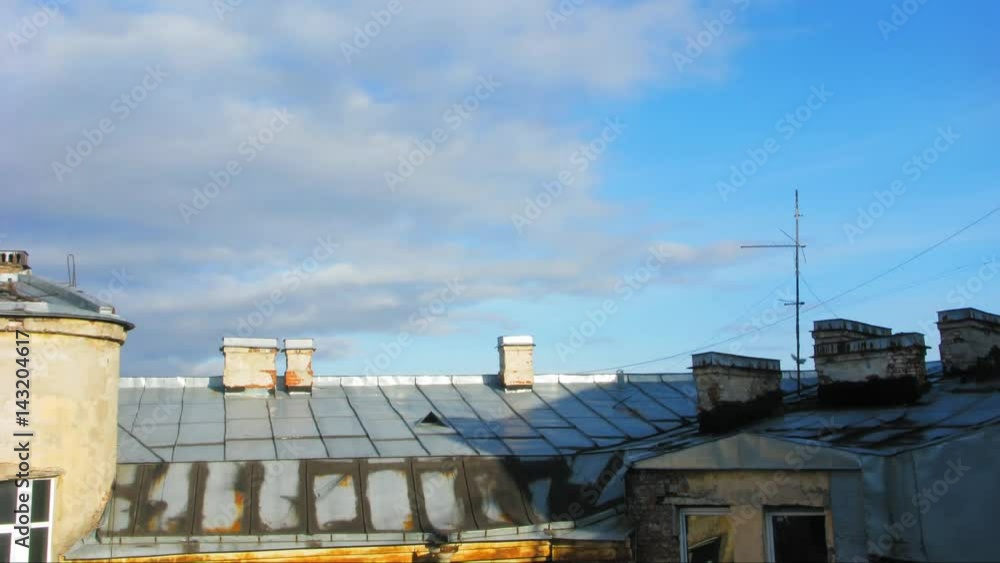 Time lapse clouds over the roof of the old city Time lapse clouds over the roof of the old city