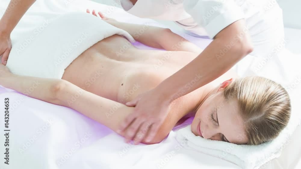 Happy lady getting relaxing massage at spa Happy lady getting relaxing massage at spa