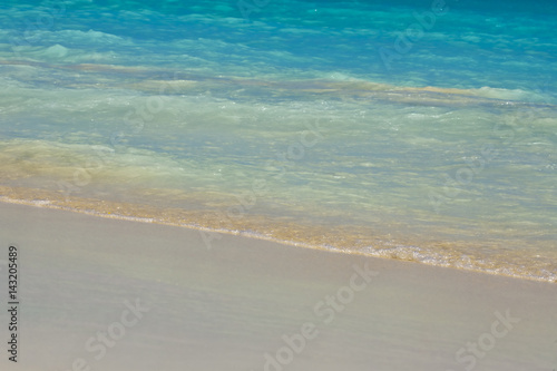 Waves on beautiful  beach © MISHELLA