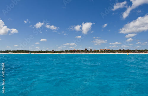 View of a resort coastline from a boat