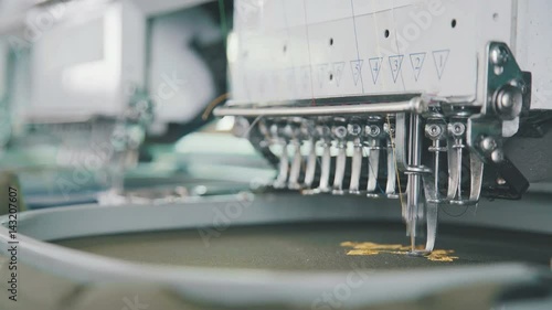 Wallpaper Mural Embroidery needle, Needle with thread. Machine embroidery work.Machine embroidery is an embroidery process whereby a sewing machine or embroidery machine is used to create patterns on textiles. Torontodigital.ca