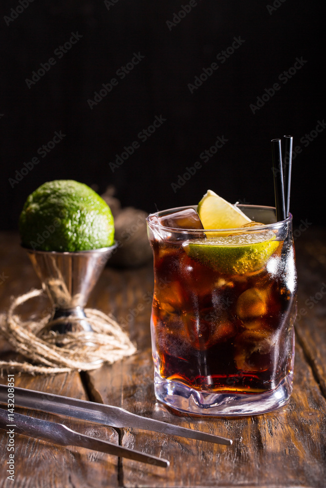 Whisky cocktail Kola with whisky, Coca and a lemon Whisky cocktail Kola with whisky, Coca and a lemon