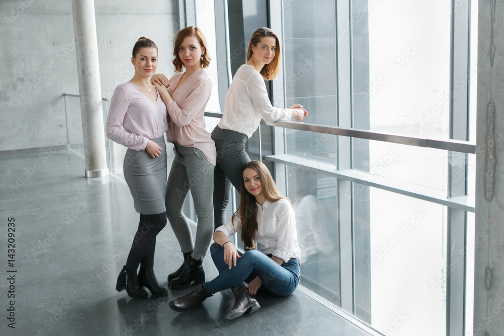 Young business team of girls in an office building Young business team of girls in an office building