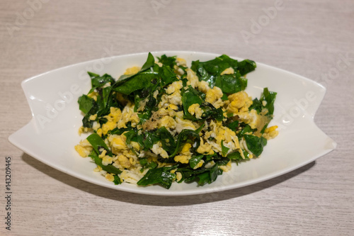 Southern Thai Vegetable Stir Fried with Eggs on the white plate