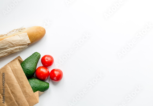 avocado and tomato with bread on table background top view mock up