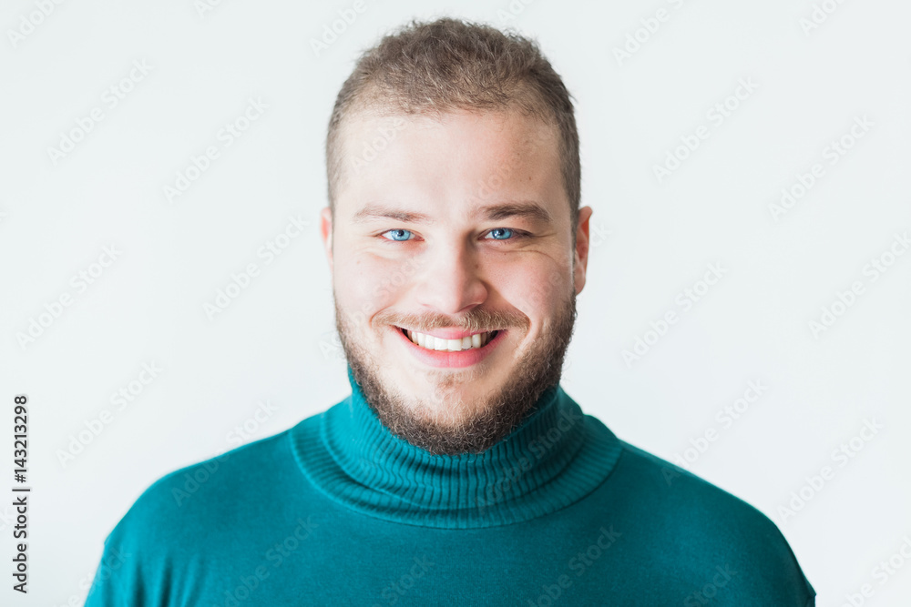 Obraz premium Portrait of a young bearded man smiling