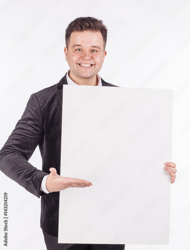 young man holding white blank panel with space for text on white background. young man holding white blank panel with space for text on white background.