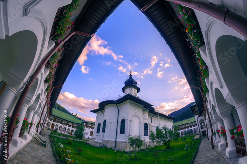 Agapia Monastery in Neamt County Romania located between mountains shot at sunset photo