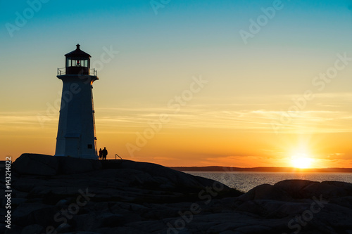 Peggy's Cove Lighthouse, Nova Scotia at sunset.