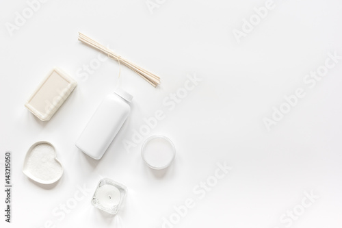 white cosmetic set on desk background top view mock up