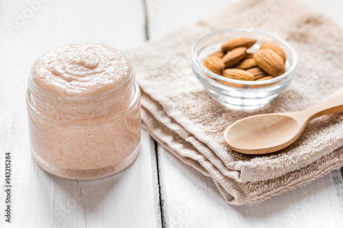 spa concept with almond nuts on wooden background