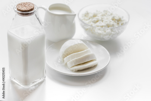 Healthy food concept with milk and cottage cheese on white table