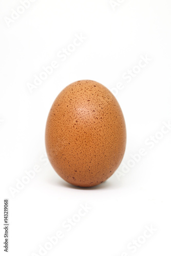 fresh chicken egg on white background. isolated brown egg.