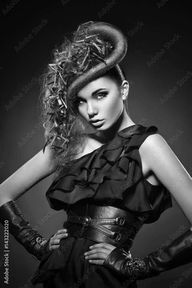 Fashion photo of young lady in elegant clothes with hairstyle Fashion photo of young lady in elegant clothes with hairstyle