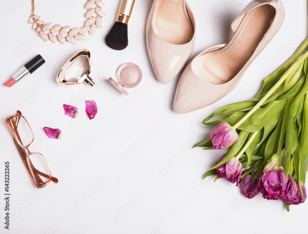 Woman's accessories and cosmetics on the white background Woman's accessories and cosmetics on the white background