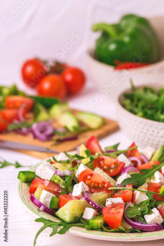 Traditional Bulgarian salad Shopski with fresh vegetables and feta