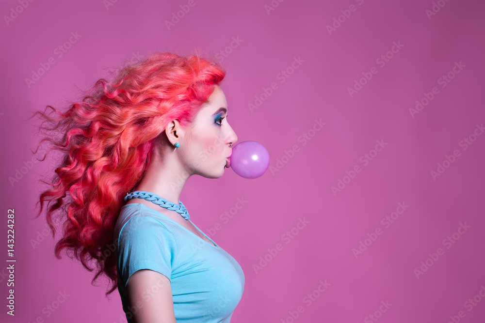 Girl with pink hair Chewing gum on a pink background and Stock Photo |  Adobe Stock