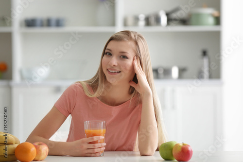 Young woman tasting fresh j...