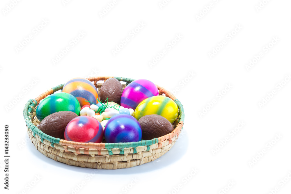 Six hand colored easter eggs in a basket - yellow, blue, green, red, pink, orange with stripes isolated in white background Six hand colored easter eggs in a basket - yellow, blue, green, red, pink, orange with stripes isolated in white background