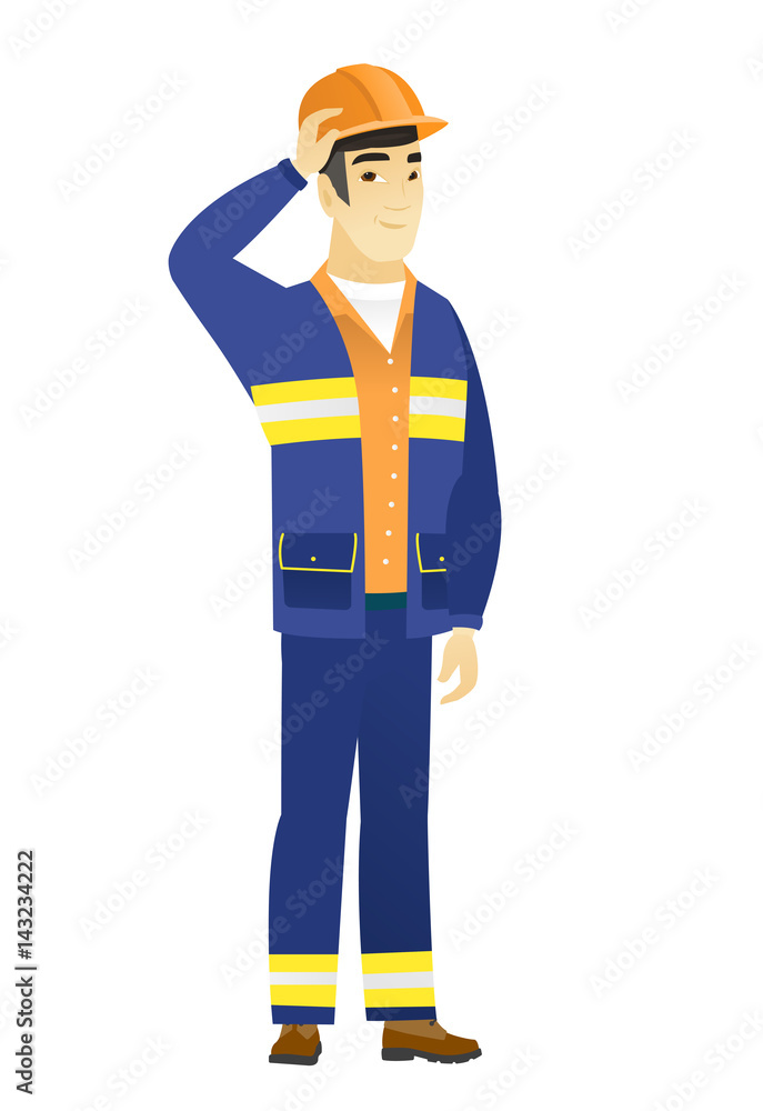 Young asian builder in workwear and hard hat. Young asian builder in workwear and hard hat.