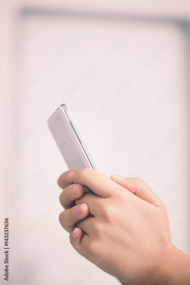 Young woman using smart phone at home Young woman using smart phone at home