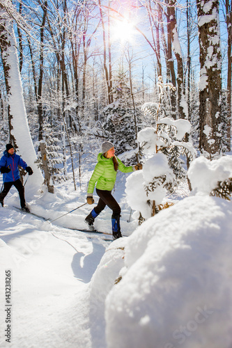 Couple cross country skiing in winter