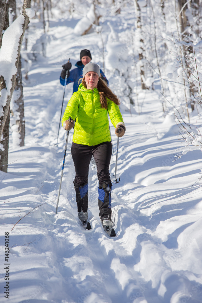 Couple cross country skiing in winter