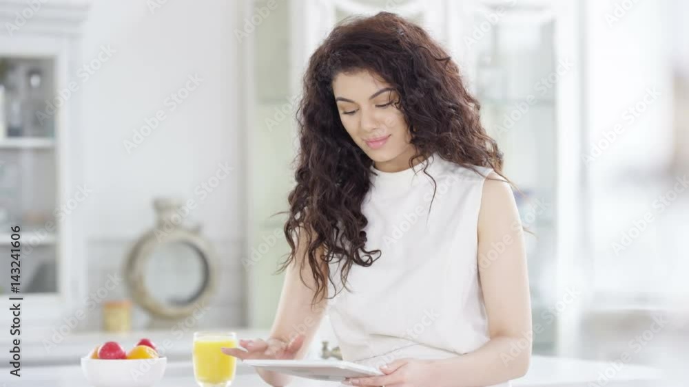 Portrait beautiful smiling woman relaxing at home with computer tablet Portrait beautiful smiling woman relaxing at home with computer tablet