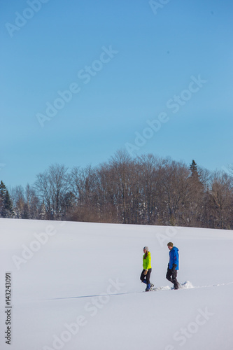 Couple Snowshoeing in fresh snow